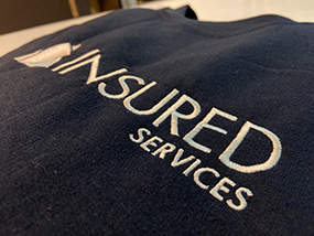 Broderie insured